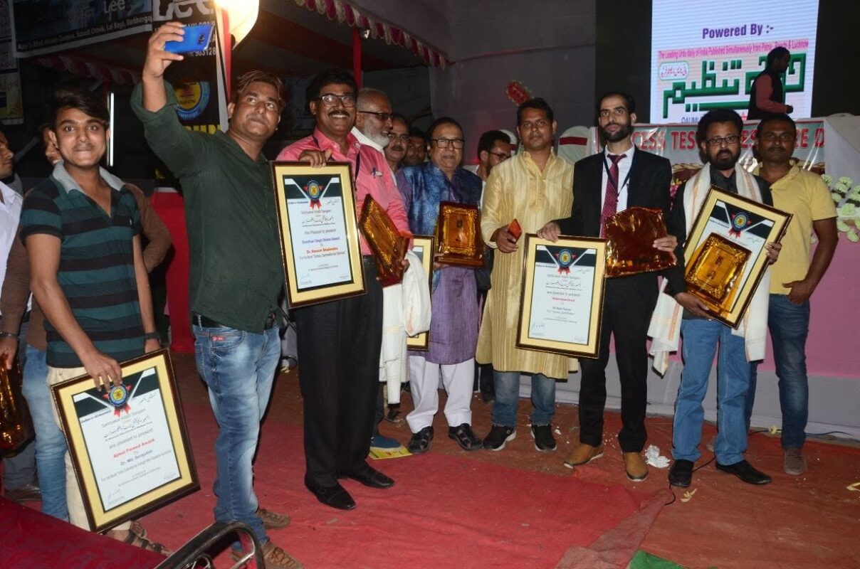 Writers and journalists holding their framed citations at a Trust honours ceremony