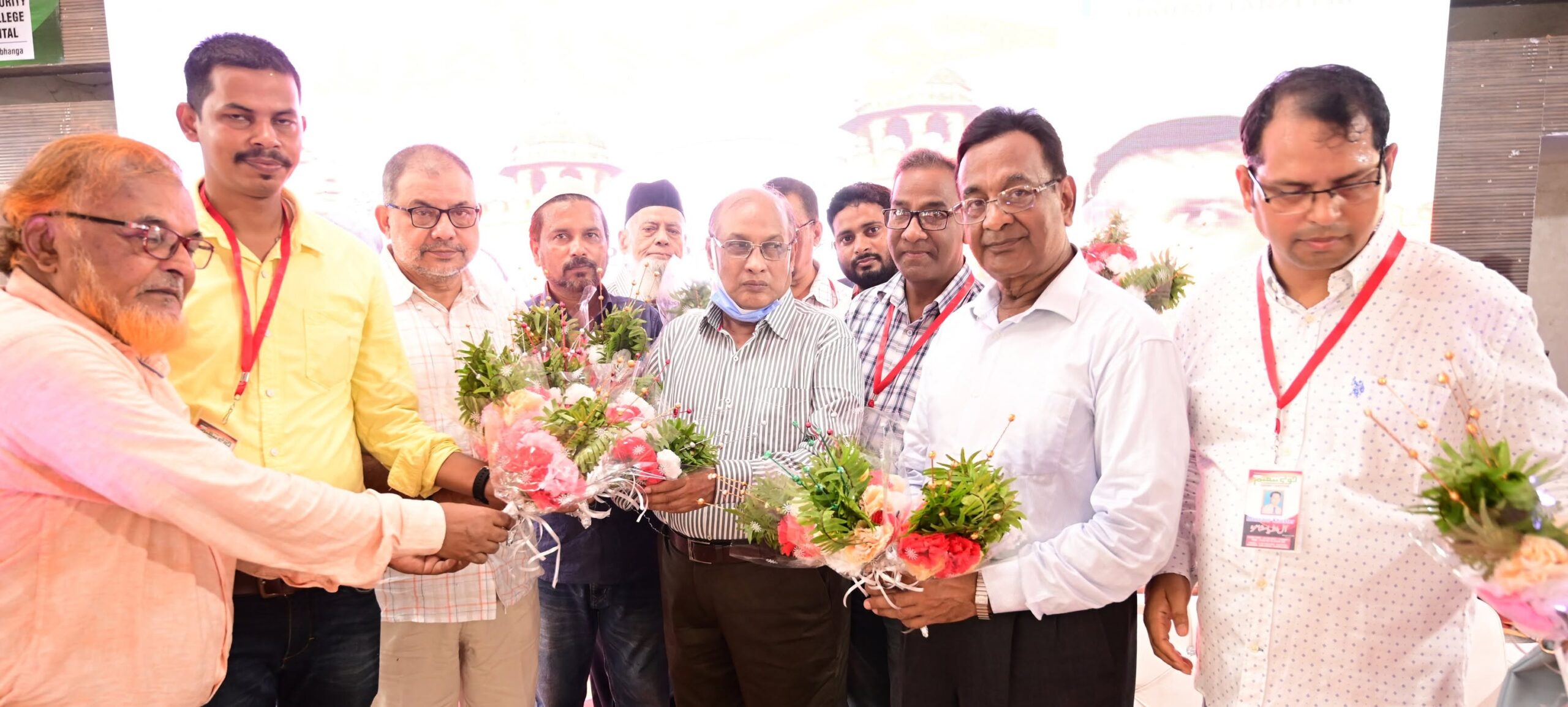 Guests being welcomed with bouquets at a literary gathering held by the Trust