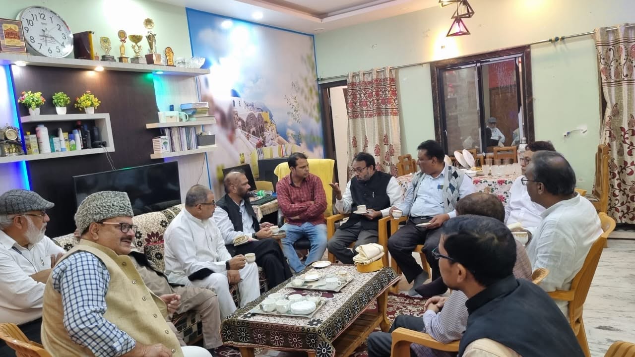 Members and guests in discussion at the Trust's office in Darbhanga